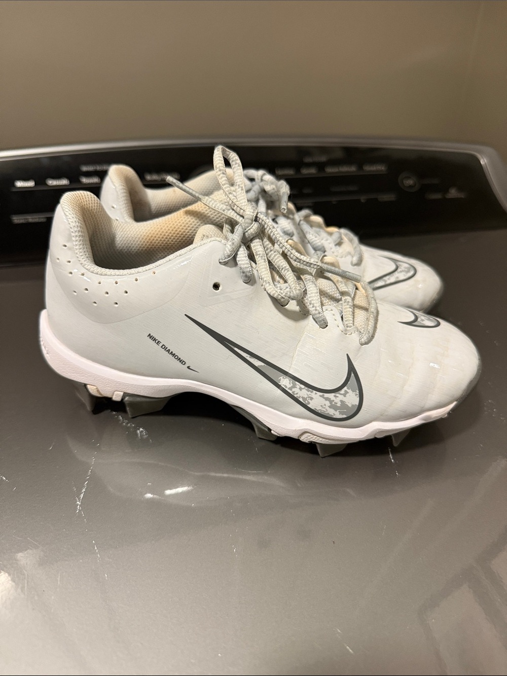 Nike Gray Softball Cleats with Silver Swoosh